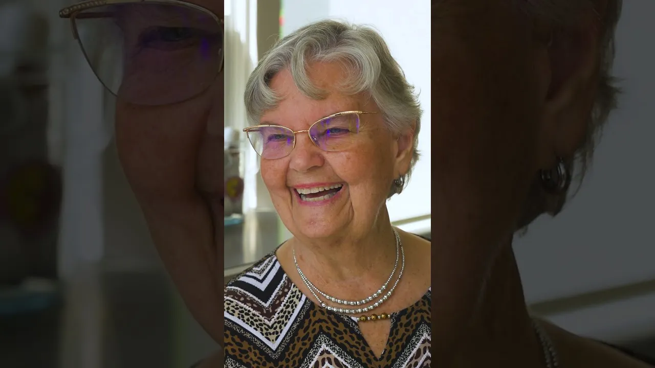 A smiling SYNERGY HomeCare client — play the video to hear from local families